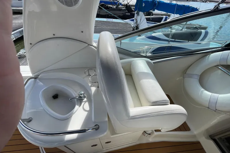 Slide: The Image of Helm of 2005 Sea Ray 340 Sundancer with Raymarine navigation system and wood-accented dashboard. - 15