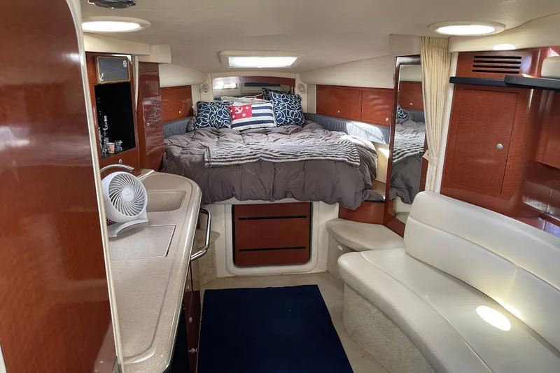 Slide: The Image of 2005 Sea Ray 340 Sundancer docked at marina under clear blue sky. - 21