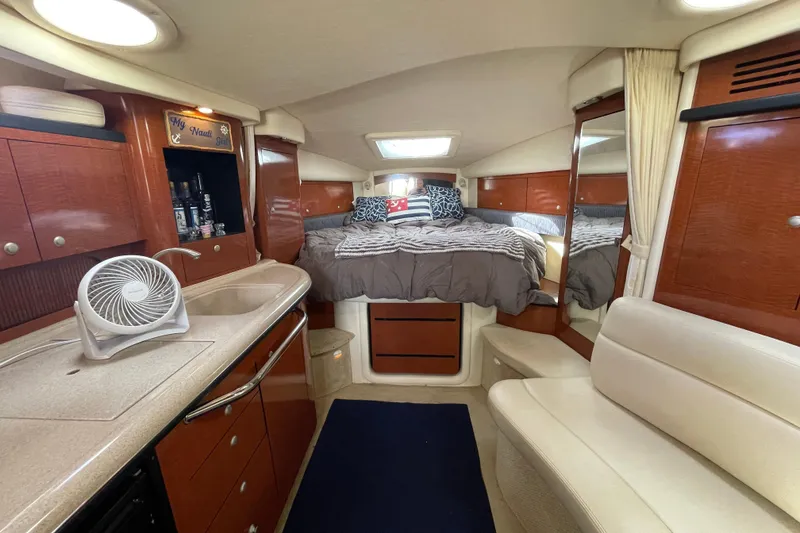 Slide: The Image of Luxurious interior of 2005 Sea Ray 340 Sundancer yacht with cozy seating and modern amenities. - 24