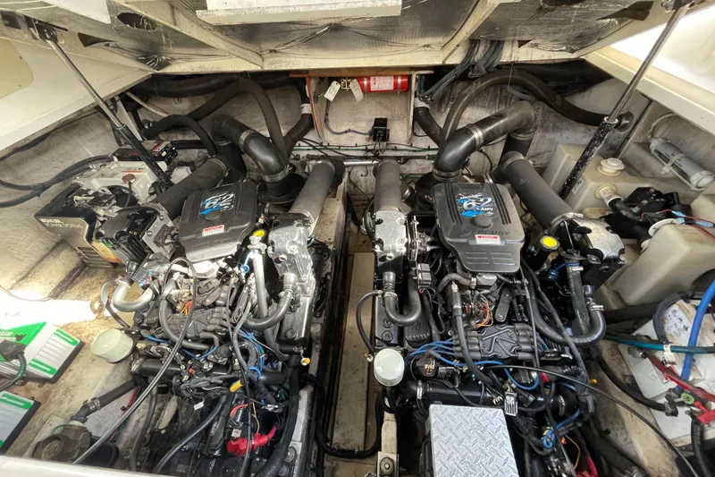 Slide: The Image of Luxurious interior of 2005 Sea Ray 340 Sundancer with curved seating and wooden cabinetry. - 29