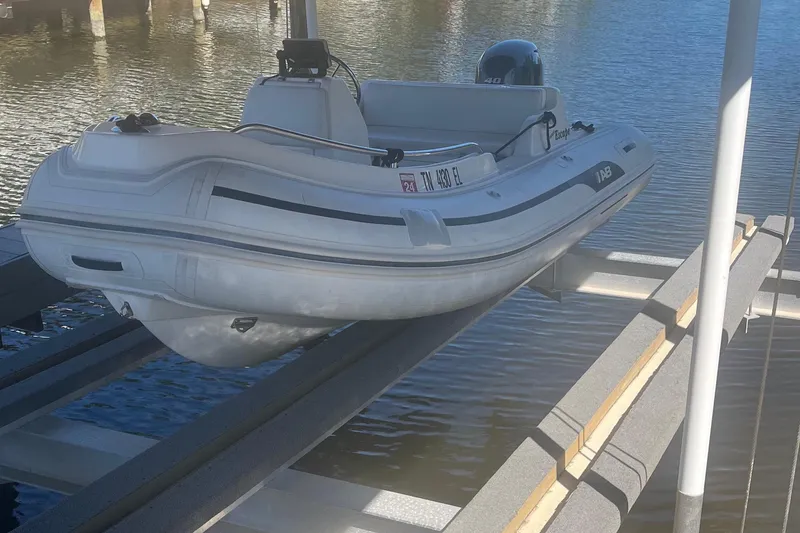 Slide: The Image of 2012 AB Inflatables Nautilus 12 DLX boat on a lift by the water. - 7