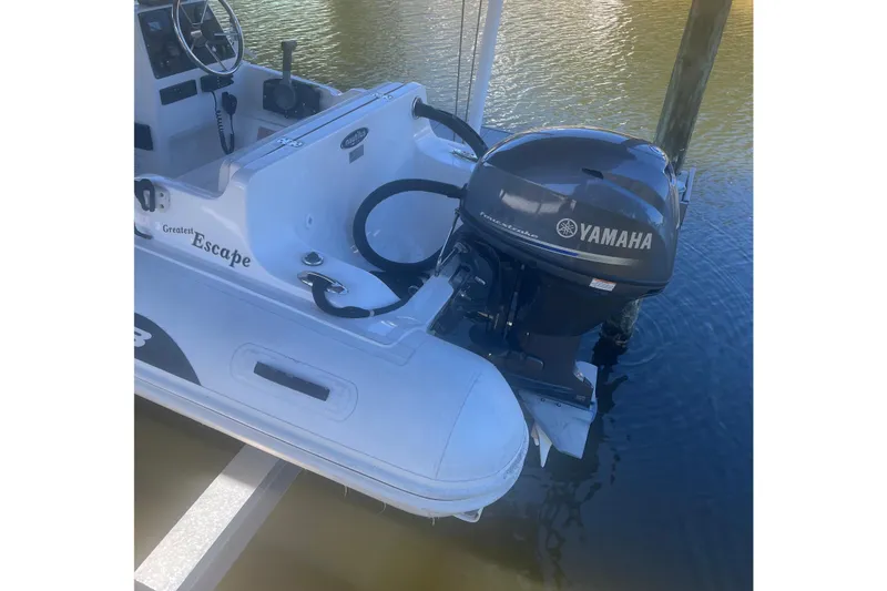 Slide: The Image of 2012 AB Inflatables Nautilus 12 DLX with Yamaha outboard motor on water. - 8