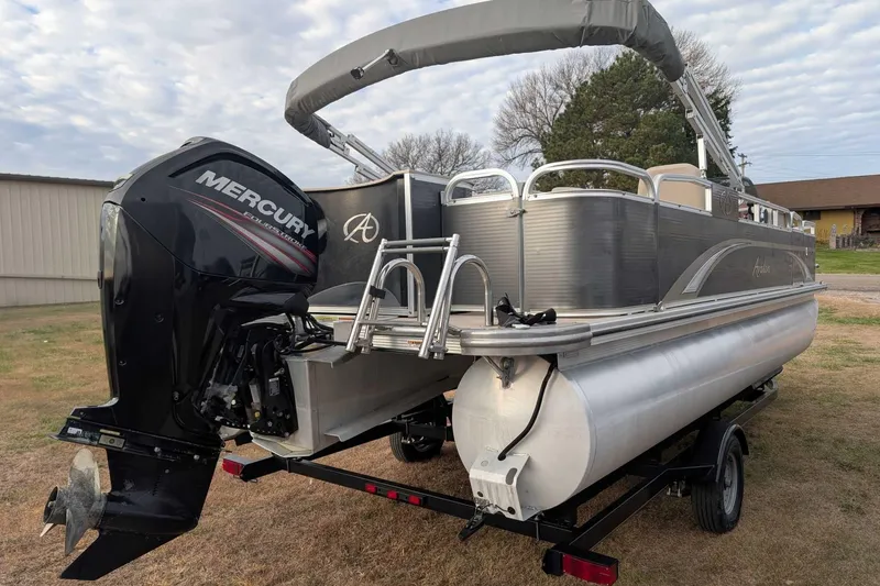 Slide: The Image of 2016 Avalon GS 22' pontoon boat with Mercury outboard motor on trailer. - 2
