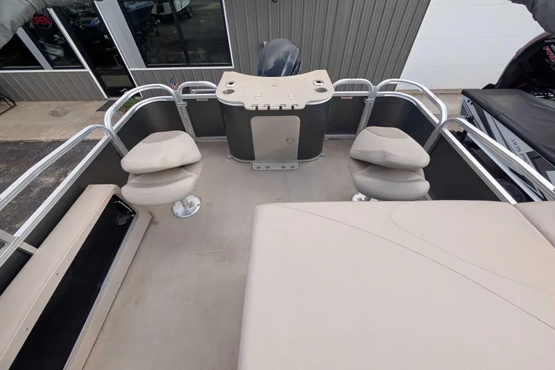 Slide: The Image of 2016 Avalon GS - 22' pontoon boat interior with seating and helm station. - 5