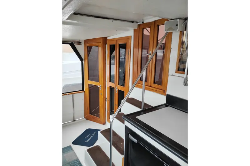 Slide: The Image of Interior of 1991 Jefferson 48 Rivanna Sundeck with wooden doors and stairs. - 10
