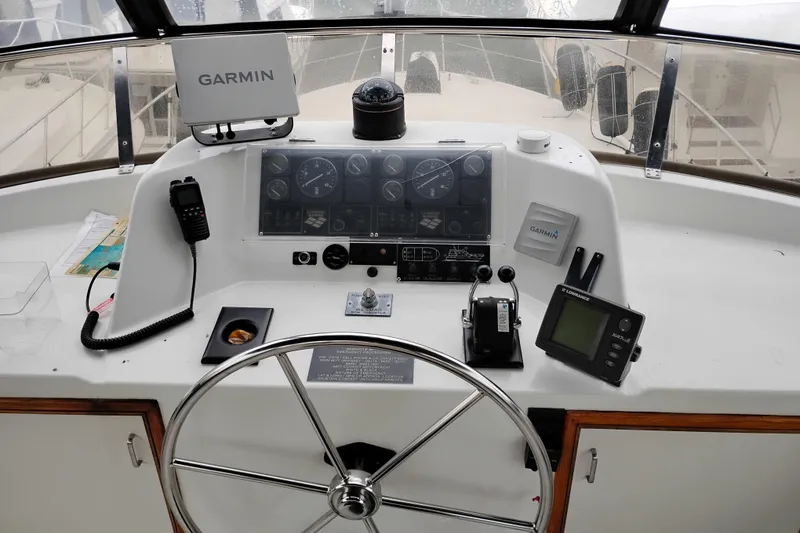 Slide: The Image of Control panel of a 1991 Jefferson 48 Rivanna Sundeck with Garmin navigation equipment. - 18