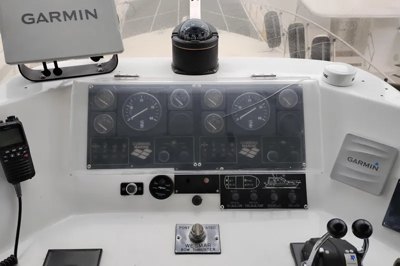 Slide: The Image of Cockpit of 1991 Jefferson 48 Rivanna Sundeck with navigation instruments and controls. - 19