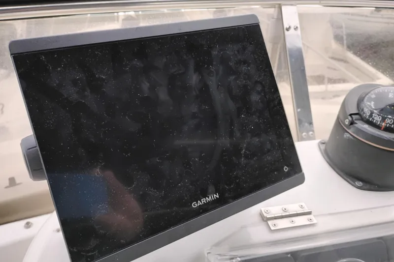 Slide: The Image of Garmin navigation display and compass on 1991 Jefferson 48 Rivanna Sundeck boat. - 20