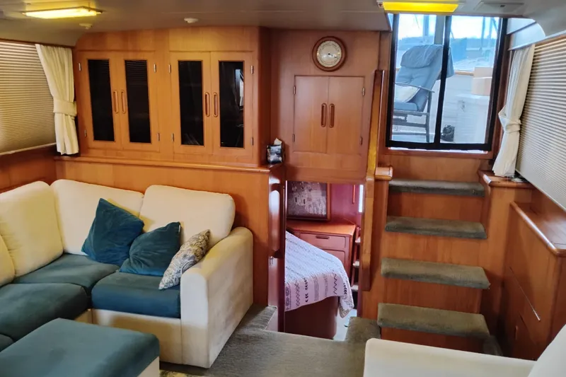 Slide: The Image of Interior of 1991 Jefferson 48 Rivanna Sundeck with cozy seating and wooden cabinetry. - 27