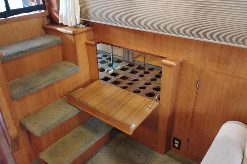 Slide: The Image of Interior of 1991 Jefferson 48 Rivanna Sundeck with wooden stairs and fold-out storage. - 28