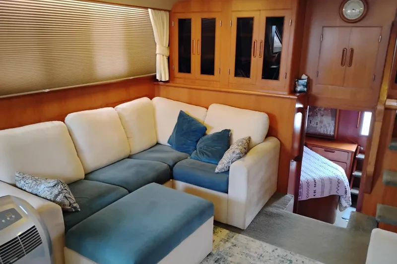Slide: The Image of Interior of 1991 Jefferson 48 Rivanna Sundeck with cozy seating and wooden cabinetry. - 30