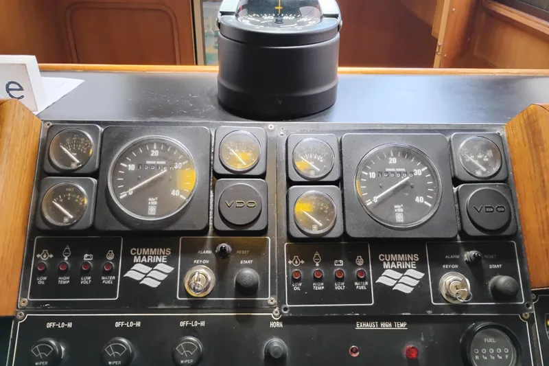 Slide: The Image of Control panel of a 1991 Jefferson 48 Rivanna Sundeck with Cummins Marine gauges. - 35