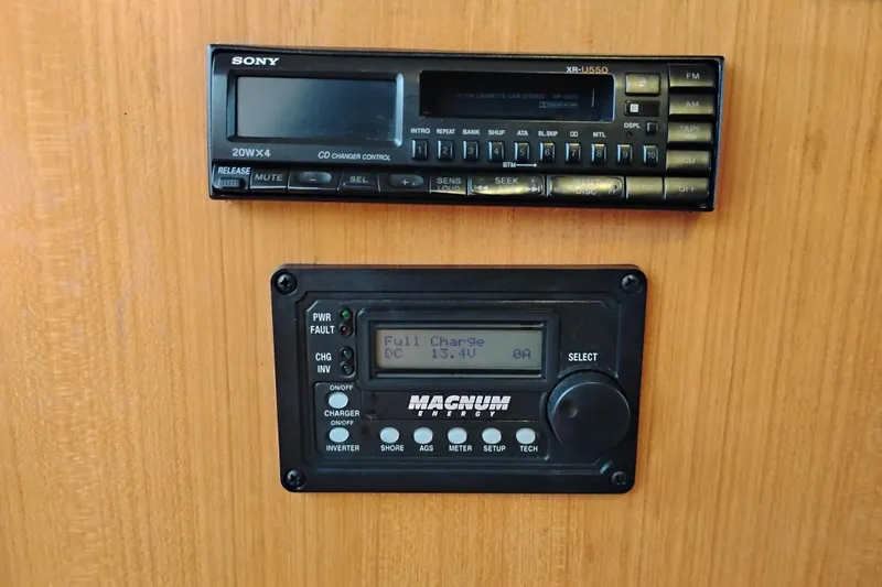 Slide: The Image of Sony stereo and Magnum Energy control panel on 1991 Jefferson 48 Rivanna Sundeck. - 37