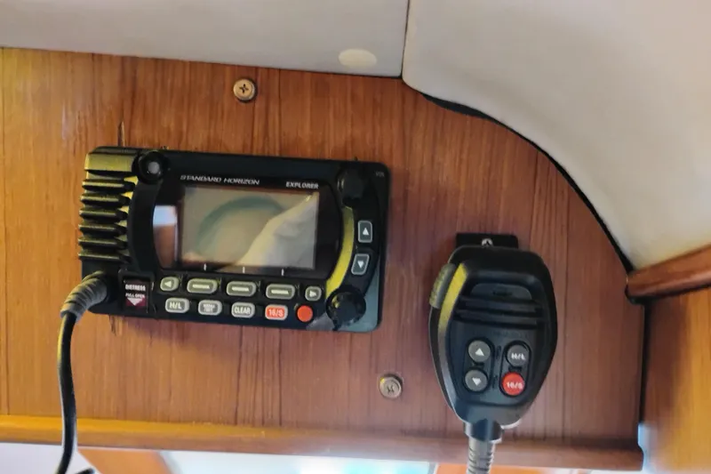 Slide: The Image of Radio equipment on 1991 Jefferson 48 Rivanna Sundeck, featuring Standard Horizon Explorer. - 39