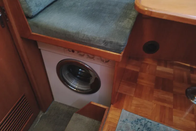 Slide: The Image of 1991 Jefferson 48 Rivanna Sundeck interior with built-in washing machine under seating. - 43