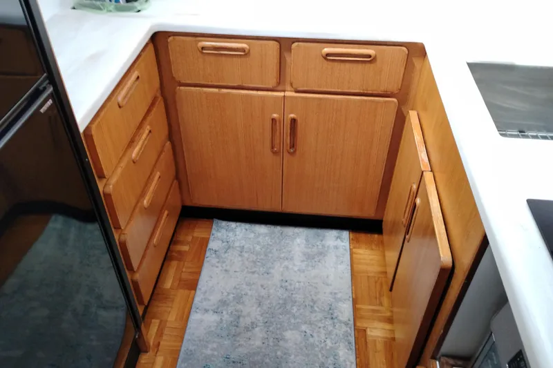 Slide: The Image of Wooden kitchen cabinetry in a 1991 Jefferson 48 Rivanna Sundeck yacht. - 45