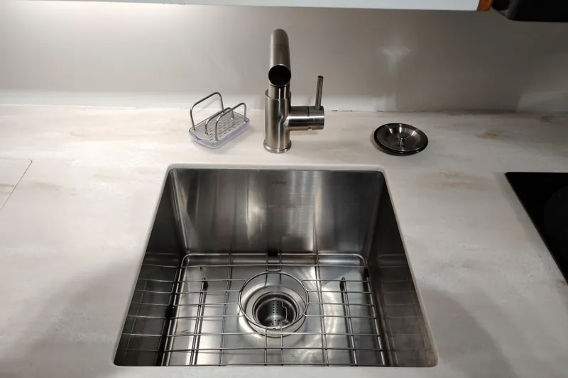 Slide: The Image of Stainless steel kitchen sink with modern faucet on a Jefferson 48 Rivanna Sundeck, 1991 model. - 46