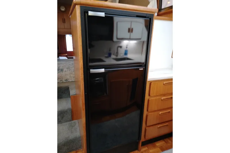 Slide: The Image of Black refrigerator in 1991 Jefferson 48 Rivanna Sundeck yacht interior kitchen. - 47