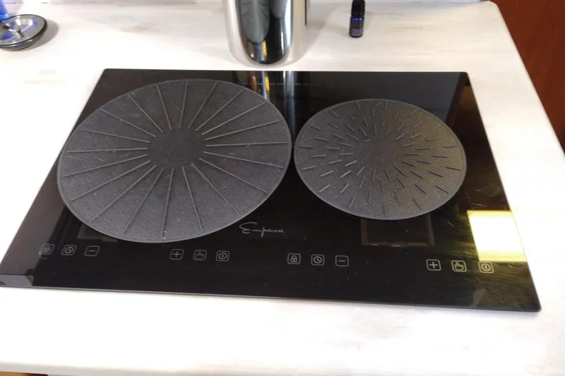Slide: The Image of Induction cooktop on 1991 Jefferson 48 Rivanna Sundeck yacht kitchen counter. - 48