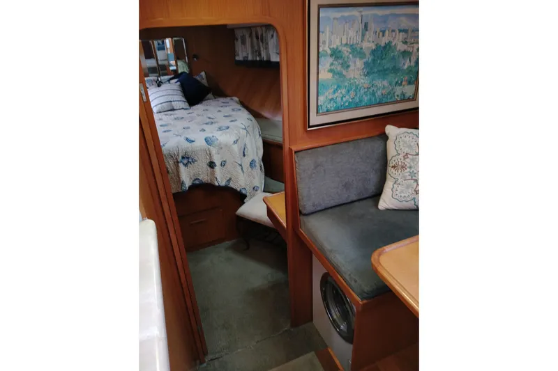 Slide: The Image of Interior of 1991 Jefferson 48 Rivanna Sundeck with cozy bed and seating area. - 50