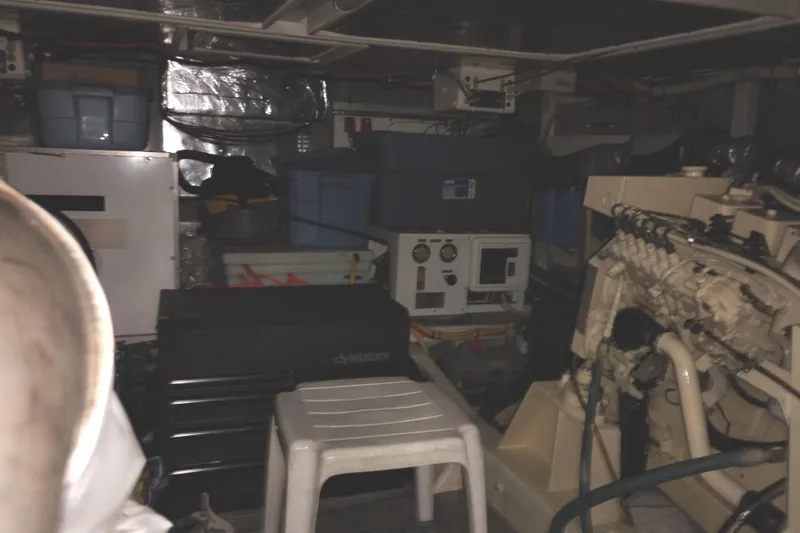 Slide: The Image of Engine room of 1991 Jefferson 48 Rivanna Sundeck with equipment and storage containers. - 69