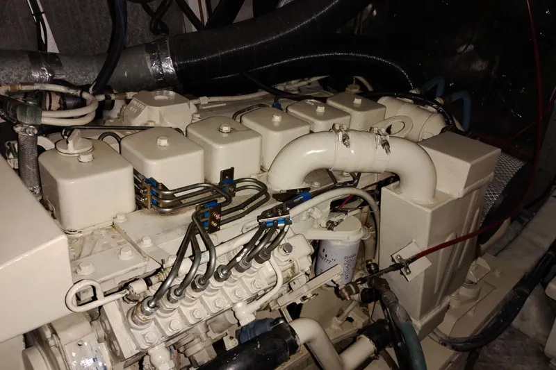 Slide: The Image of Engine of a 1991 Jefferson 48 Rivanna Sundeck yacht, showcasing intricate mechanical components. - 70