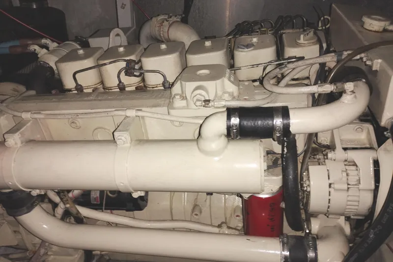 Slide: The Image of Engine of a 1991 Jefferson 48 Rivanna Sundeck boat, showcasing mechanical components. - 71