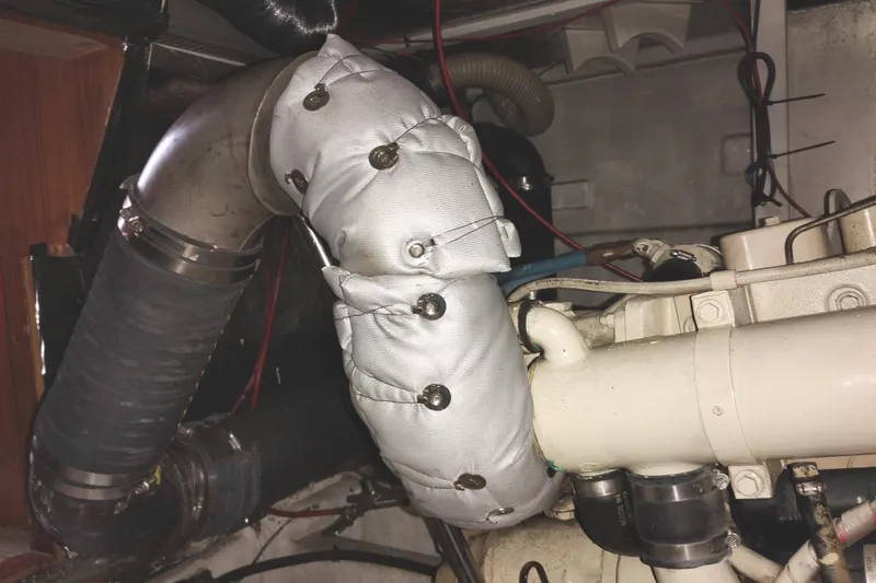 Slide: The Image of Engine compartment of a 1991 Jefferson 48 Rivanna Sundeck with insulated exhaust pipe. - 73