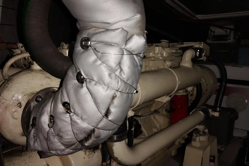 Slide: The Image of Engine compartment of a 1991 Jefferson 48 Rivanna Sundeck yacht, featuring insulated components. - 75