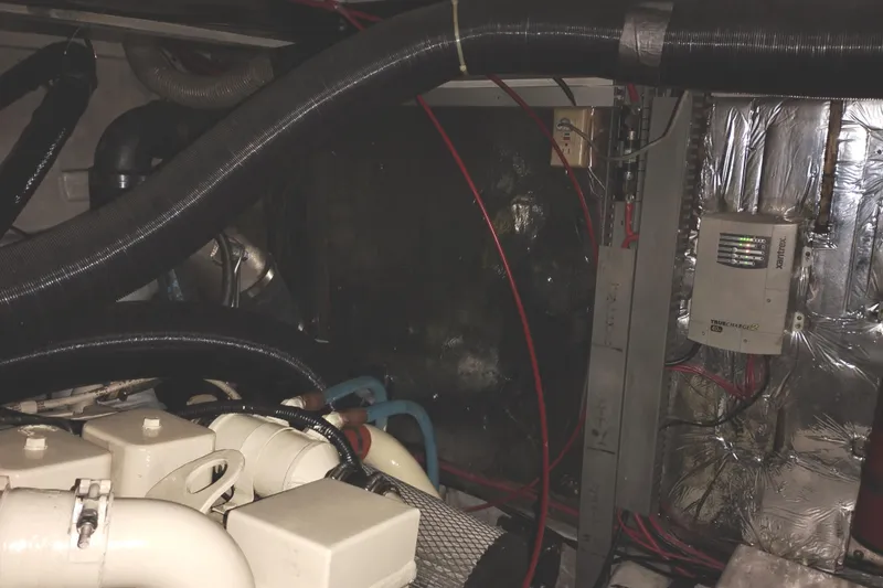 Slide: The Image of Engine room of 1991 Jefferson 48 Rivanna Sundeck with wiring and mechanical components. - 76