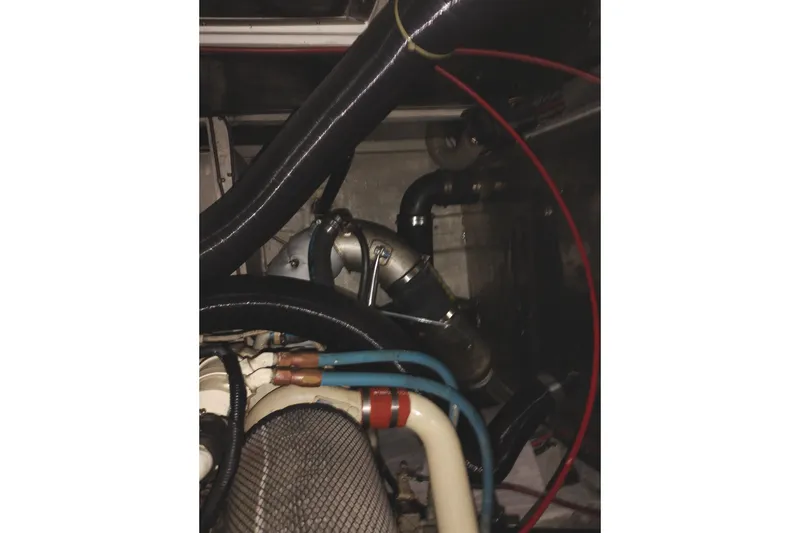 Slide: The Image of Engine compartment of 1991 Jefferson 48 Rivanna Sundeck with visible hoses and wiring. - 78