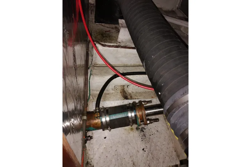 Slide: The Image of Engine compartment of 1991 Jefferson 48 Rivanna Sundeck with visible hoses and fittings. - 79