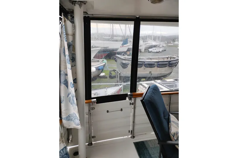 Slide: The Image of Interior view of 1991 Jefferson 48 Rivanna Sundeck with marina background. - 8