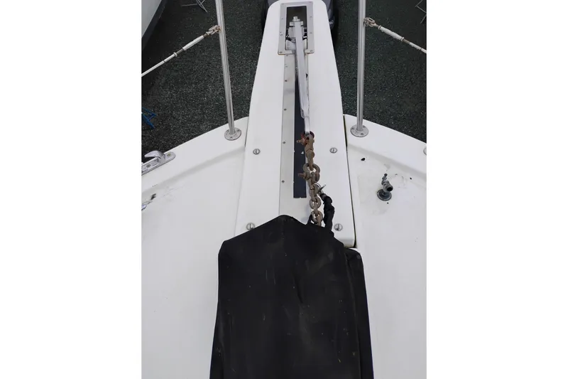 Slide: The Image of Bow view of 1991 Jefferson 48 Rivanna Sundeck yacht with anchor chain. - 81