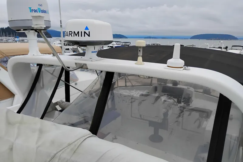 Slide: The Image of 1991 Jefferson 48 Rivanna Sundeck with Garmin and TracVision equipment at marina. - 87