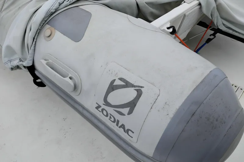 Slide: The Image of Inflatable Zodiac boat on 1991 Jefferson 48 Rivanna Sundeck yacht. - 90