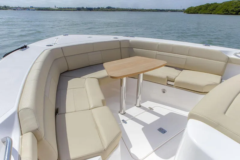 Slide: The Image of 2019 Pursuit S 408 Sport boat with spacious seating on calm water. - 10