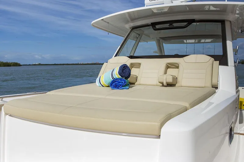 Slide: The Image of 2019 Pursuit S 408 Sport boat on water under clear blue sky. - 12