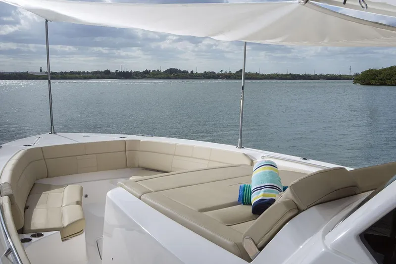 Slide: The Image of 2019 Pursuit S 408 Sport boat cockpit with advanced navigation system on open water. - 13