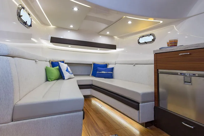 Slide: The Image of 2019 Pursuit S 408 Sport yacht interior with TV, cabinetry, and modern design. - 22