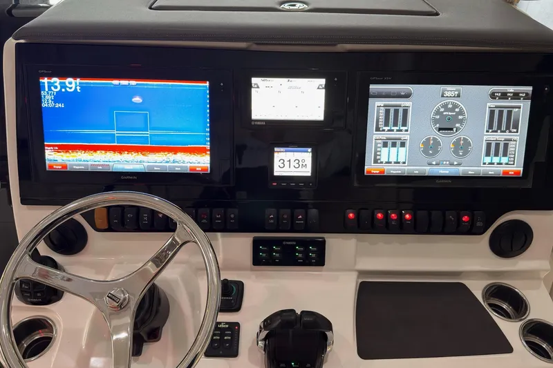 Slide: The Image of Control panel of 2019 Pursuit S 408 Sport boat with Garmin displays and steering wheel. - 27