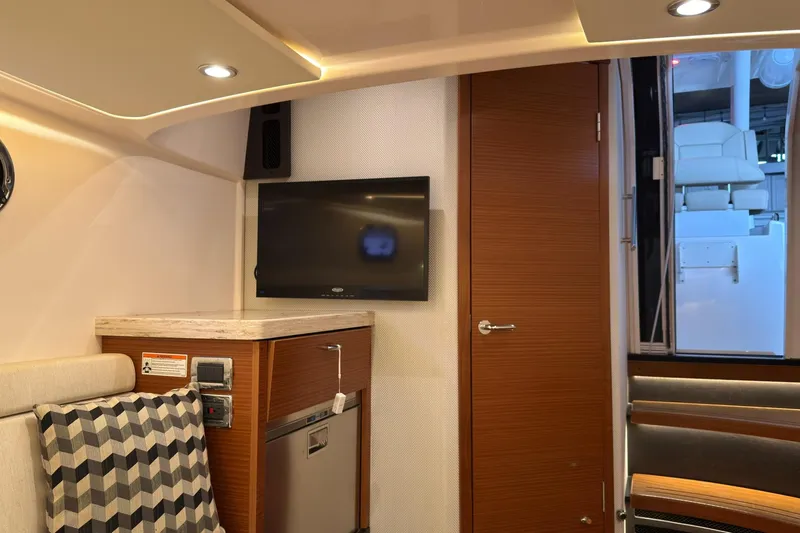 Slide: The Image of Interior of 2019 Pursuit S 408 Sport boat with TV, seating, and modern design. - 41