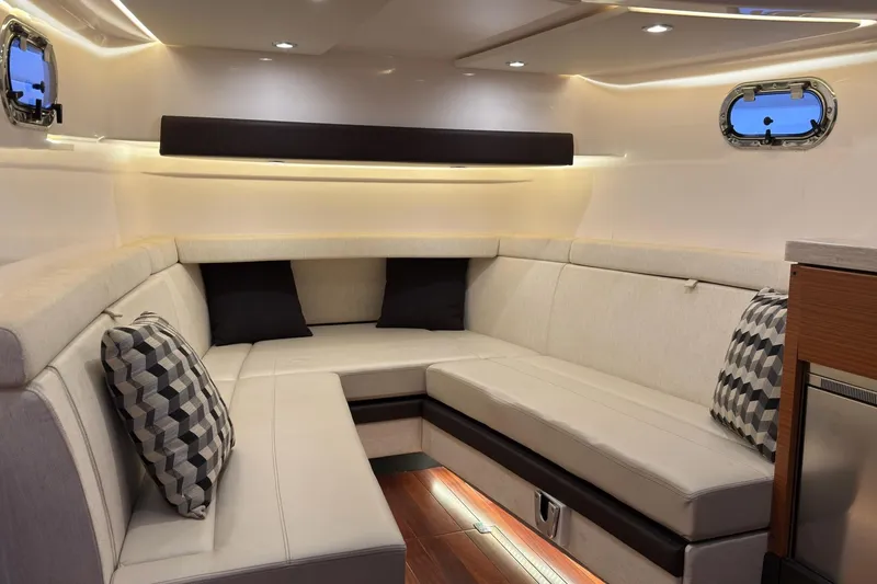 Slide: The Image of Luxurious interior of 2019 Pursuit S 408 Sport boat with plush seating and ambient lighting. - 46
