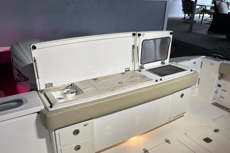 Slide: The Image of 2019 Pursuit S 408 Sport boat with open storage and sink area. - 51