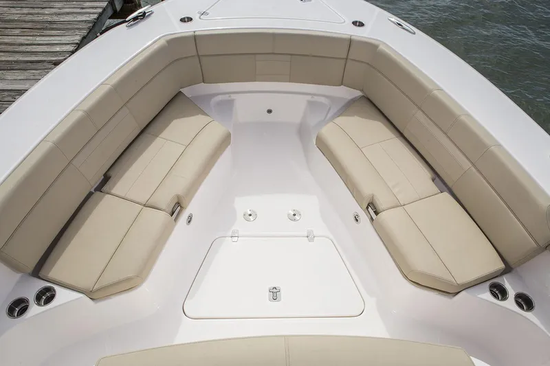 Slide: The Image of 2019 Pursuit S 408 Sport boat with spacious seating and table on open water. - 9