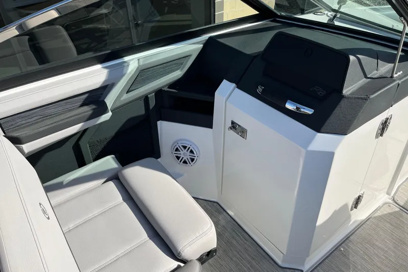Slide: The Image of Interior of 2022 Cobalt R8 boat featuring sleek seating and modern dashboard design. - 11