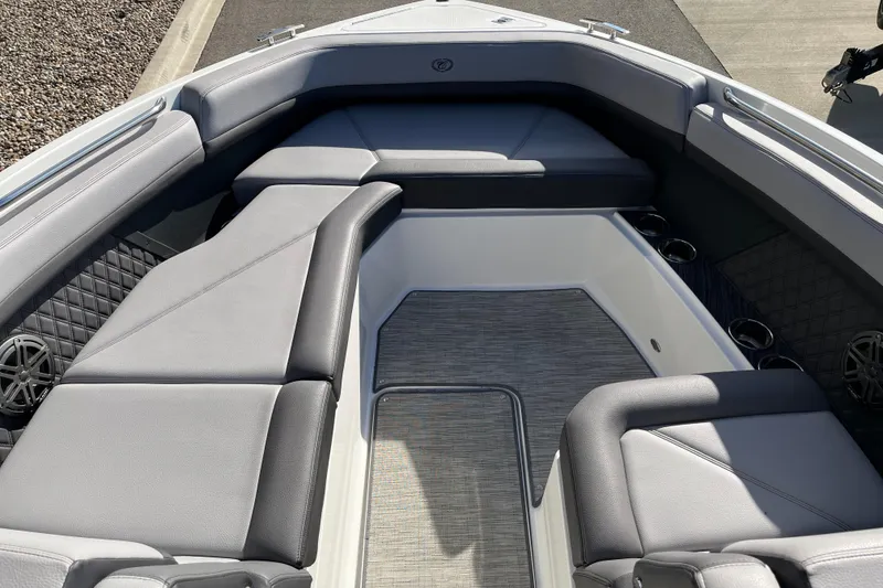 Slide: The Image of 2022 Cobalt R8 boat interior with luxurious gray seating and cup holders. - 13