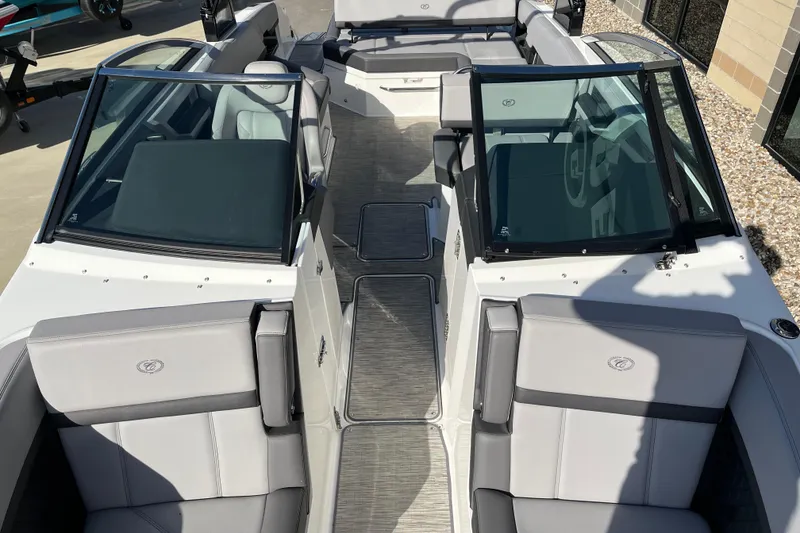 Slide: The Image of 2022 Cobalt R8 boat interior with gray seating and dual windshields. - 14