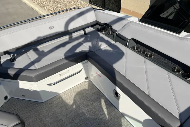 Slide: The Image of 2022 Cobalt R8 boat interior with gray seating and cup holders. - 15