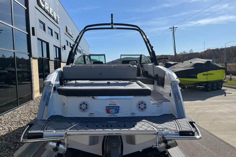 Slide: The Image of 2022 Cobalt R8 boat at dealership, rear view with seating and speakers. - 6